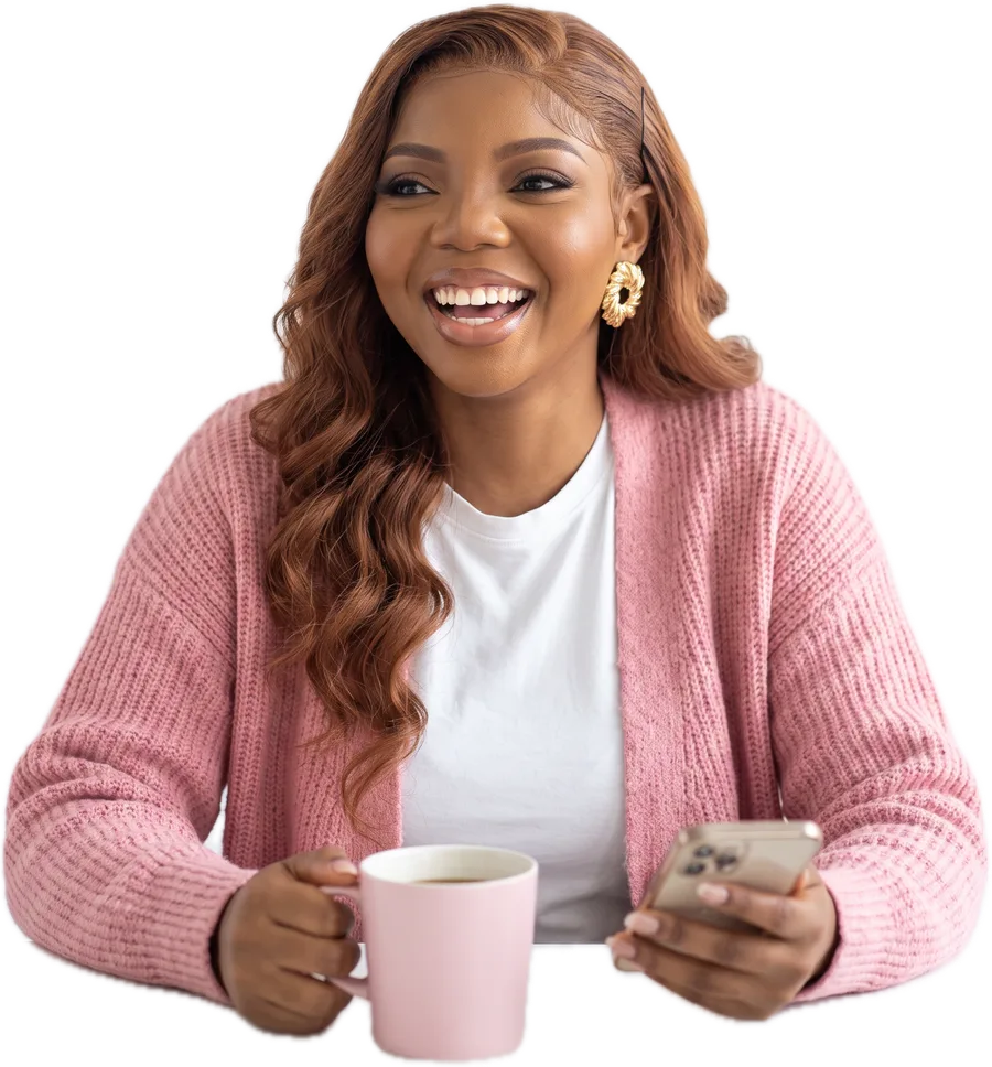 Faith laughing, holding a pink mug
